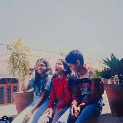 Me with my younger sisters in 2004.