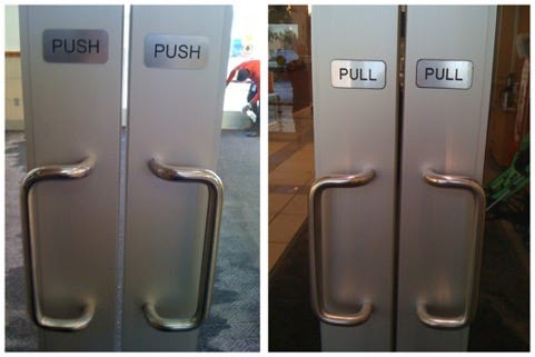 An example of a Norman Door — handles indicate pull even though the labels indicate push.