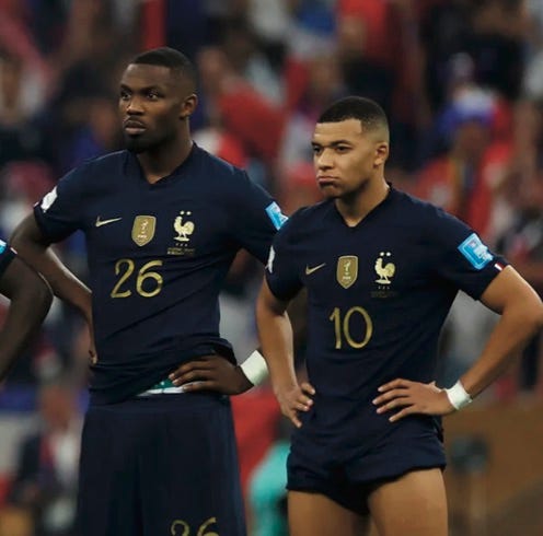 photo of two disappointed French players