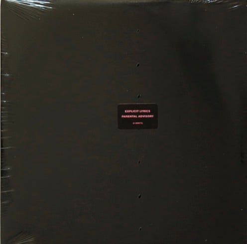 front of record cover for Prince’s Black album. Cover is plain black with only a sticker stuck in the middle stating. “Parental Advisory Explicit Lyrics.”