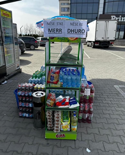 A free food stand with stacks of packaged food and beverages