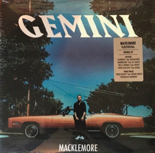 front of record cover for Macklemore’s Gemini album