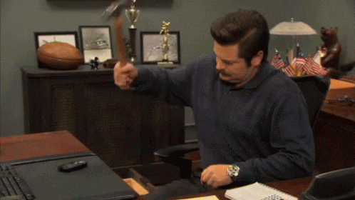 Phone Reaction GIF by MOODMAN — A man angrily destroys his mobile phone with a hammer