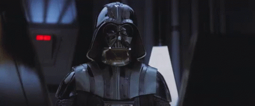 GIF of Darth Vader from Star Wars doing a “force choke” on imperial officers.