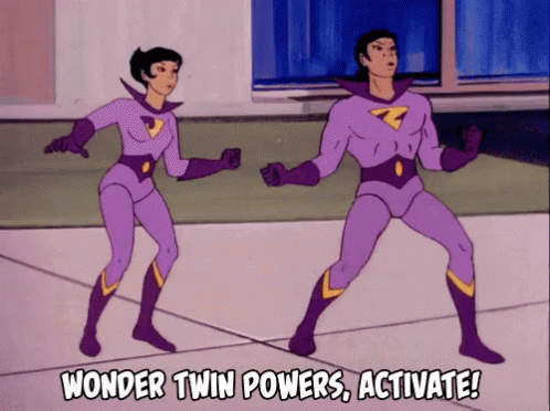 Wonder Twins touching their fists and saying “Wonder Twin powers, activate!”
