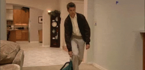 Gif of man falling over onto a carpet