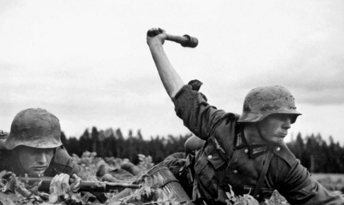 German soldiers marching during World War II, showcasing the Wehrmacht forces engaged in various theaters of operation, including the Eastern and Western Fronts. The image reflects the complex composition and motivations of the military, as well as the challenges faced by German soldiers in the post-war era