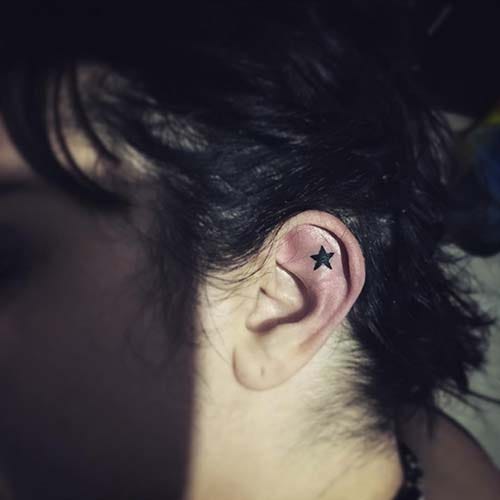 star tattoo in ear