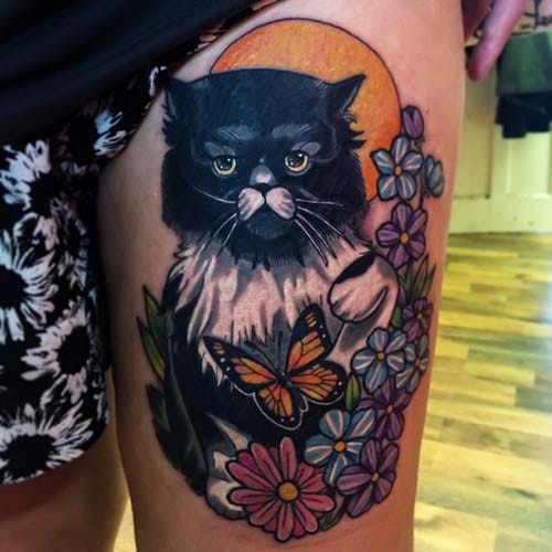 female thigh cat tattoo