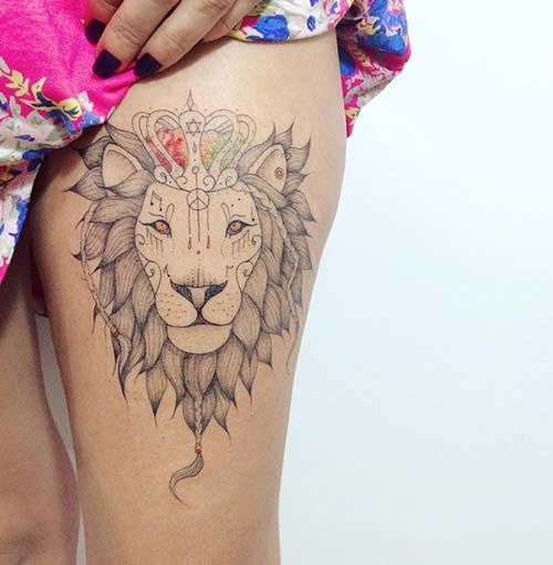 woman thigh lion tattoo