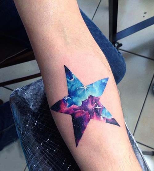 forearm watercolor galaxy star tattoo