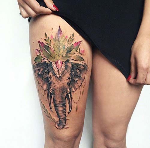 woman thigh elephant tattoo