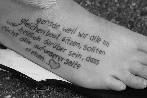 written text tattoo 536