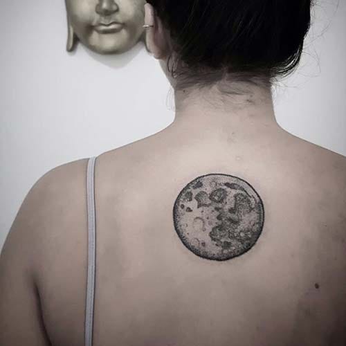 woman back fullmoon tattoo