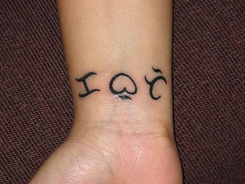 written text tattoo 553