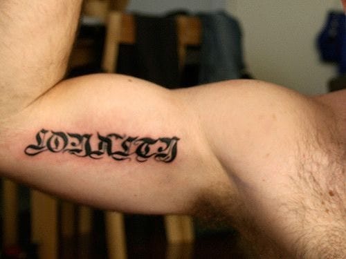 written text tattoo 566