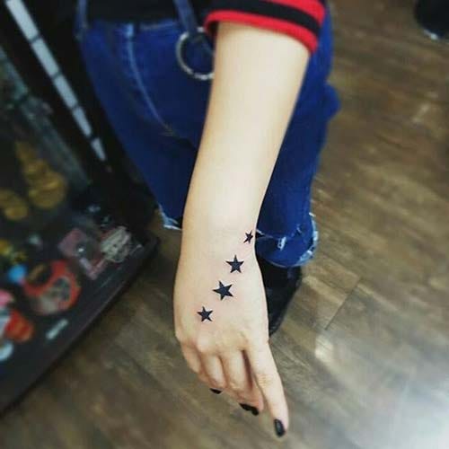 four star tattoo on habd