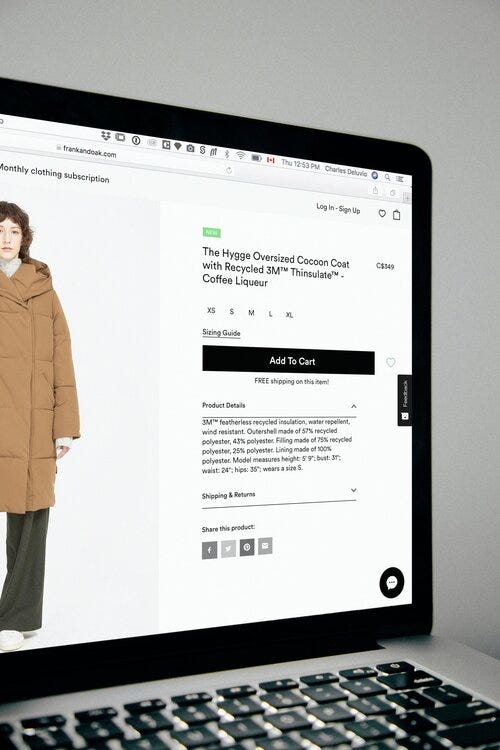 Online shopping website interface. Add to cart button applied next to an image of a woman modeling a large coat. “Recycled” Sustainable fashion website post.