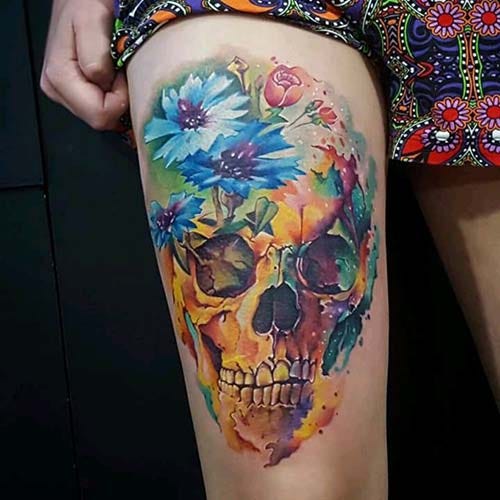 female upper leg colorful dry head tattoo woman thigh colorful skull tattoo