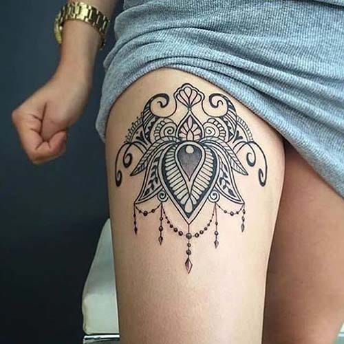 woman thigh mandala tattoo