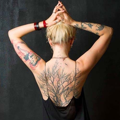 woman back big tree tattoo