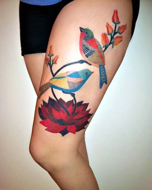 woman thigh bird tattoo