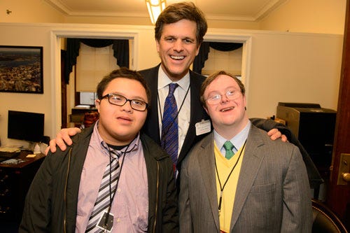 Special Olympics President and CEO Dr. Timothy Shriver with Special Olympics athlete John Franklin Stevens (r) and Best Buddies Ambassador Kevin Leon (l).