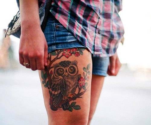 woman upper leg owl tattoo woman thigh owl tattoo