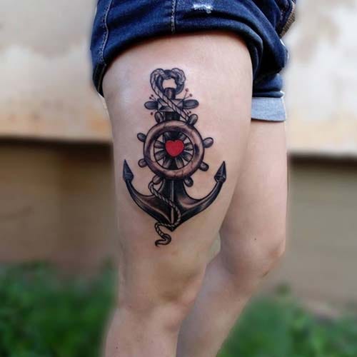 woman upper leg anchor tattoo