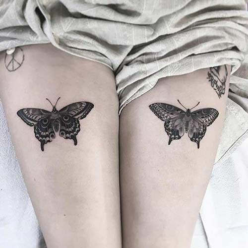 woman thigh butterfly tattoo