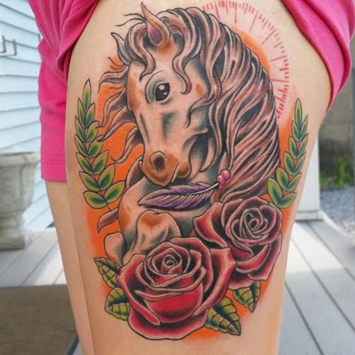 woman upper leg horse tattoo