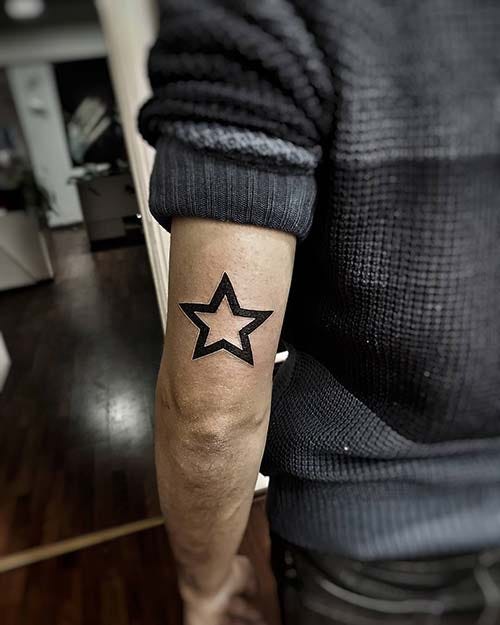 man arm back star tattoo man arm back star tattoo