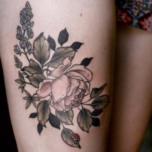 women thigh flower tattoo