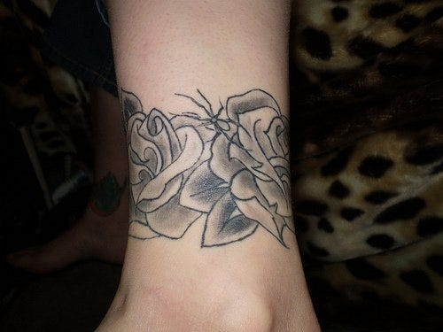 1099 ankle tattoo