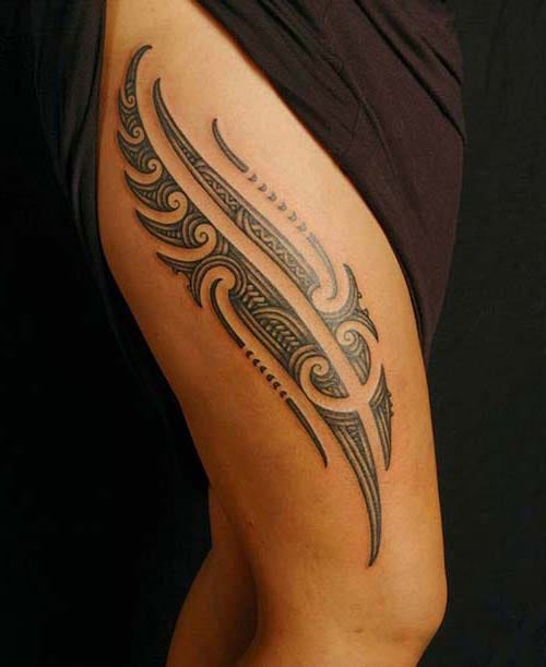 woman thigh tribal tattoo