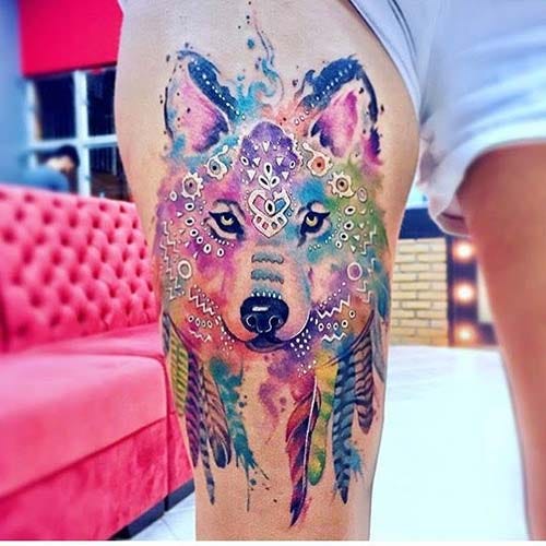 woman upper leg colorful wolf tattoo woman thigh watercolor wolf tattoo