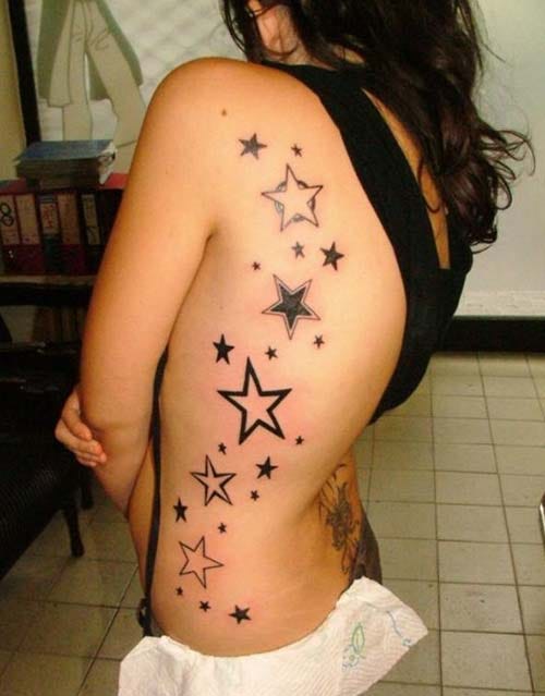 woman side stars tattoo