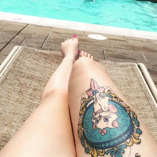 woman thigh cute cat tattoo