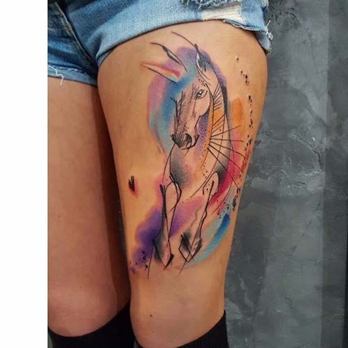 woman upper leg colorful horse tattoo woman thigh watercolor horse tattoo