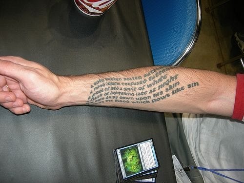 written text tattoo 558