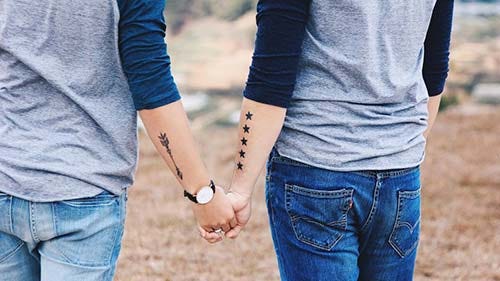 couple star and arrow tattoo