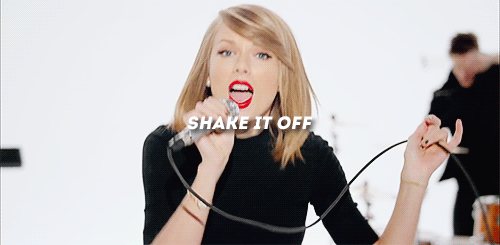 Taylor Swift singing her hit shake it off