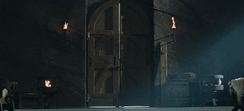 Aragorn throwing doors open in The Two Towers gif.