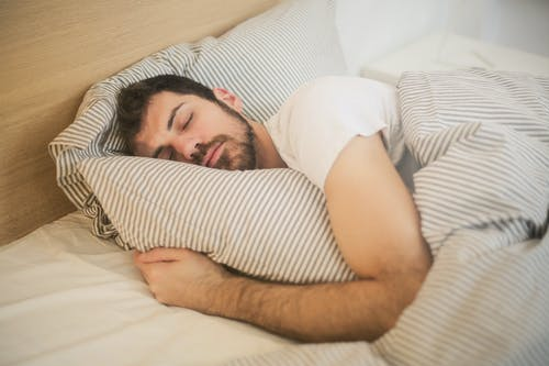 A person maintaining a healthy sleep cycle