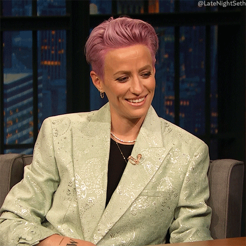 Megan Rapinoe, rocking her pink hair, acting nonchalant.