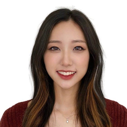 Headshot of Dana, a Korean-American woman, smiling and wearing a burgundy sweater and pendant.