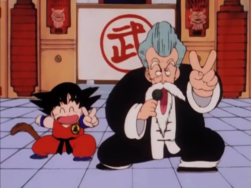 Kid Goku next to Master Roshi, who is disguised as ‘Jackie Chun’.