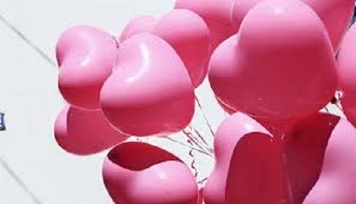 Heart shaped pink balloons