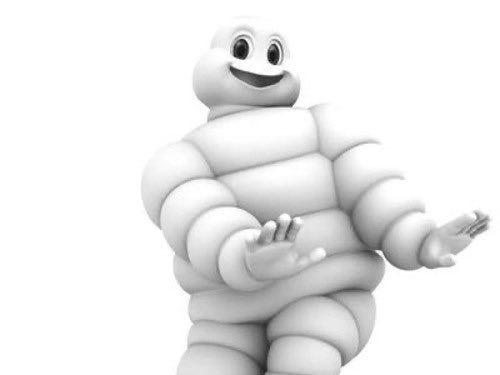 Michelin man smiling and dancing.
