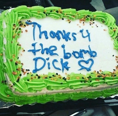 A green and white cake with sprinkles and blue icing that reads “Thanks 4 the bomb Dick ❤.”
